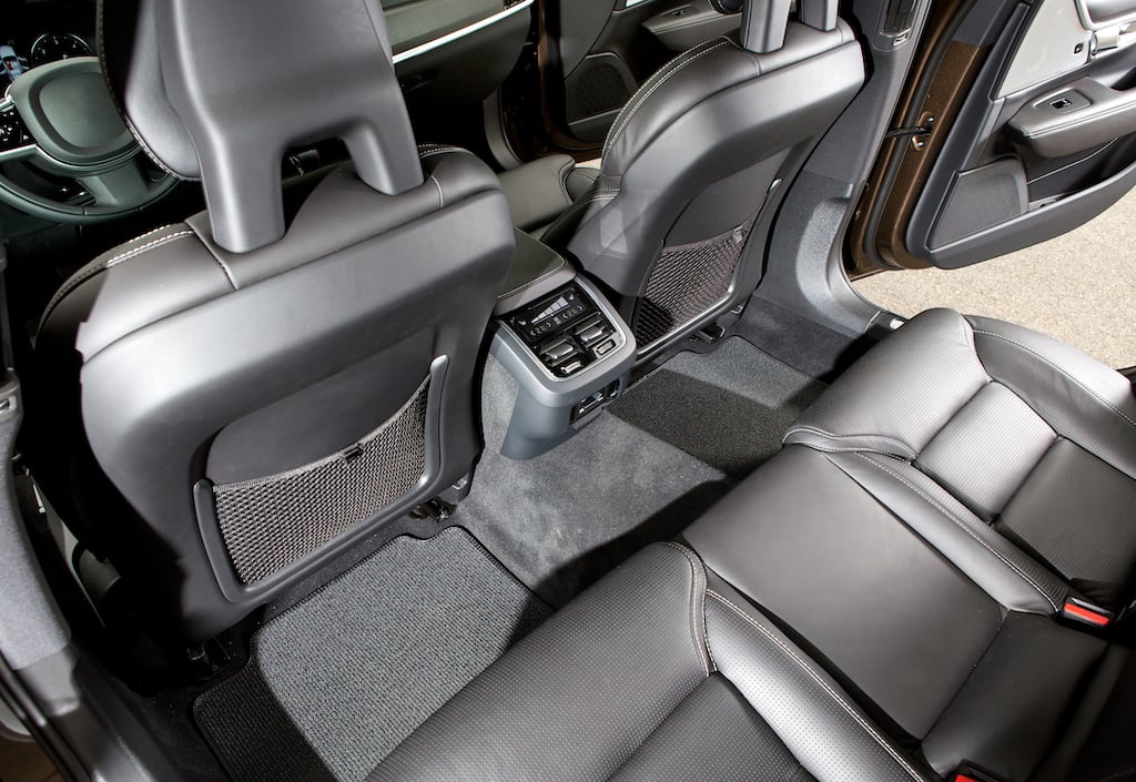 Back seat of a modern luxury car. Riding a smooth ride in a expensive taxi car.