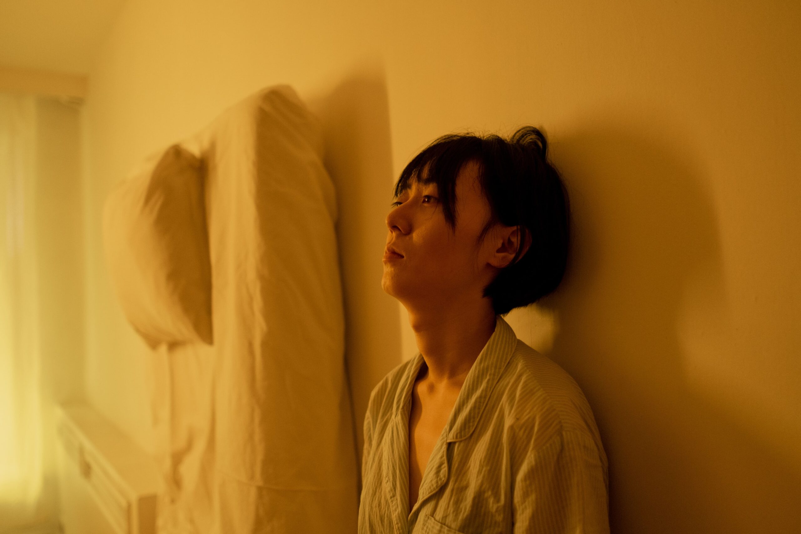 sad woman leaning on the wall